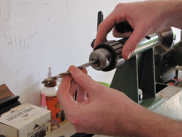 insterting a 7mm drill bit into the mini-lathe drill chuck