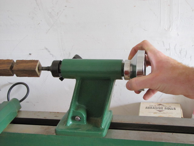 bring your tailstock up, lock it into place, and tighten it with the tailstock handwheel