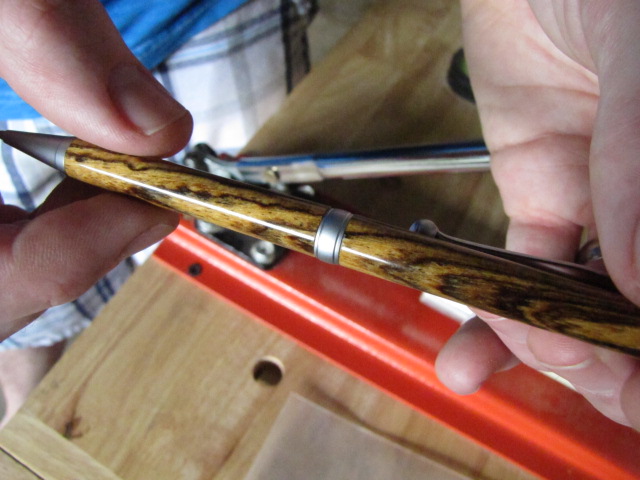 an assembled, handmade wooden pen